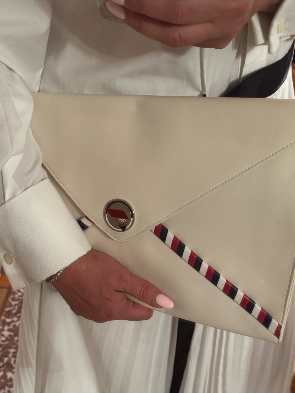 Chanel  Envelope Clutch with Red-Trim Accent in White 
This envelope never worn